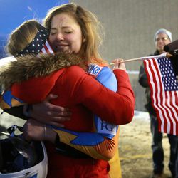 USA's Kate Hansen gets a hug from Ashley Holt while celebrating qualifying for the Olympic team at the luge World Cup at the Utah Olympic Park in Park City on Friday, Dec. 13, 2013.