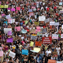 Demonstrators protest against sexism and in defense of womens' rights in Brasilia, Brazil, Saturday, June 22, 2013. Demonstrators once again took to the streets of Brazil on Saturday, continuing a wave of protests that have shaken the nation and pushed the government to promise a crackdown on corruption and greater spending on social services.  