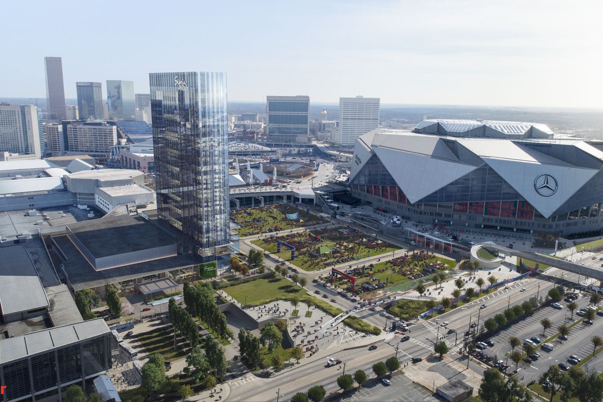 A wide-angle rendering shows how the glassy hotel would lord over the massive Mercedes-Benz Stadium.