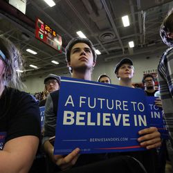 People listen as Democratic presidential candidate Bernie Sanders speaks to a crowd of 4,800 people at a rally at West High School in Salt Lake City on Monday, March 21, 2016. 