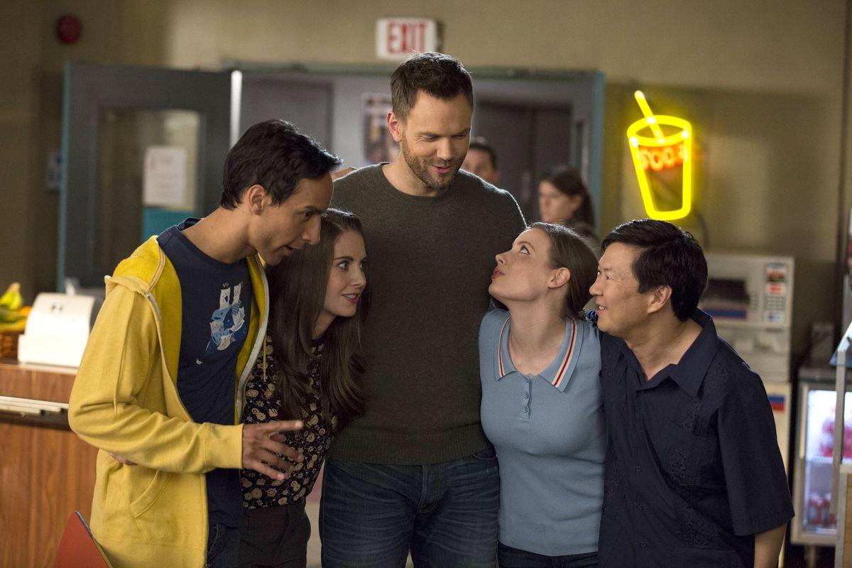 The cast of Community —&nbsp;Danny Pudi, Alison Brie, Joel McHale, Gillian Jacobs, and Ken Jeong —&nbsp;hug in a still from the original TV series.