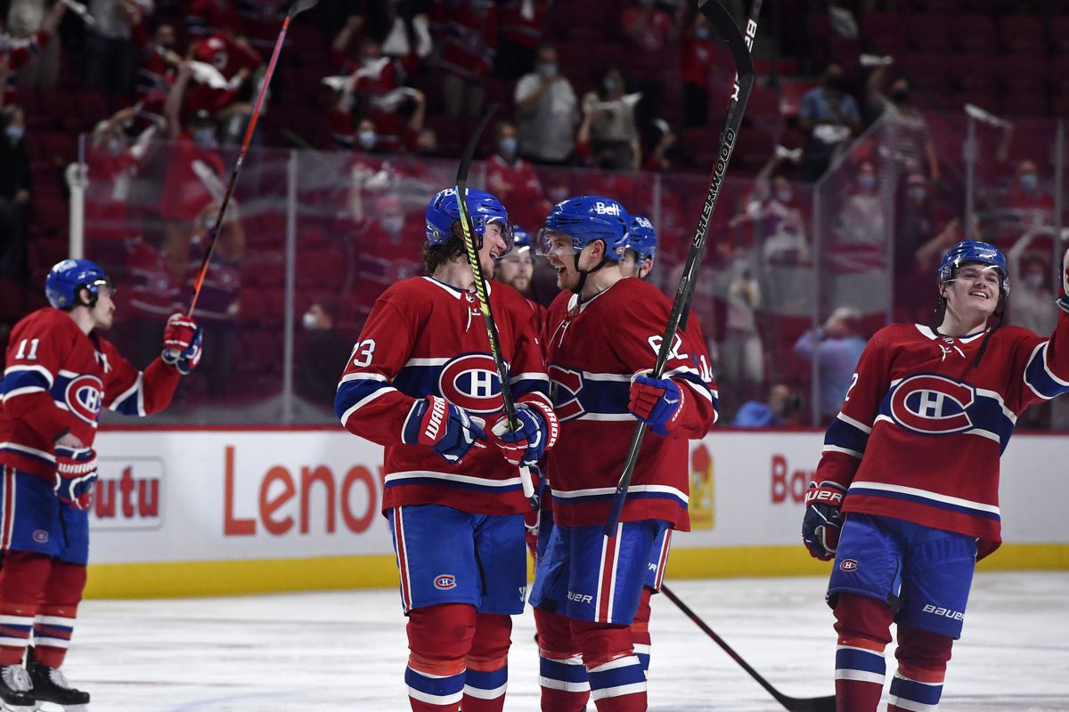 Montreal Canadiens forward Tyler Toffoli (73) and teammate forward Artturi Lehkonen (62) celebrate the series win against the Winnipeg Jets during the overtime period in game four of the second round of the 2021 Stanley Cup Playoffs at the Bell Centre.