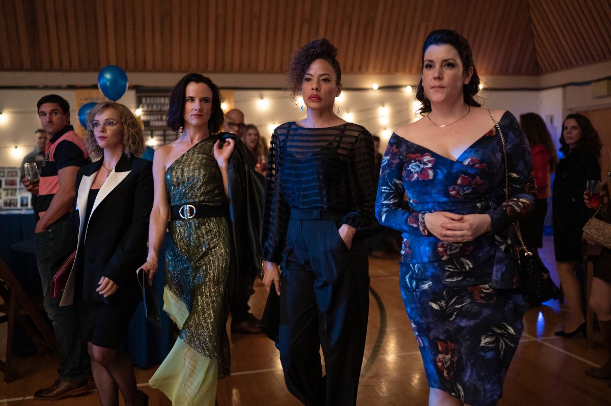 The adult ladies of Yellowjackets season 1 walking into their 25 year reunion