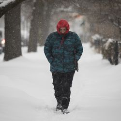 Residents try to keep warm on West Birchwood Avenue. | Ashlee Rezin/Sun-Times