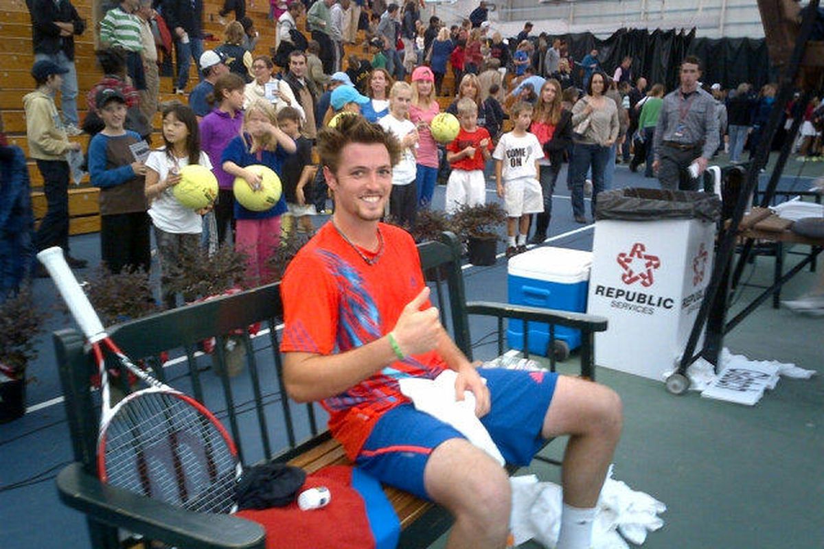 Rhyne Williams gives a tired thumbs up after beating Denis Kudla