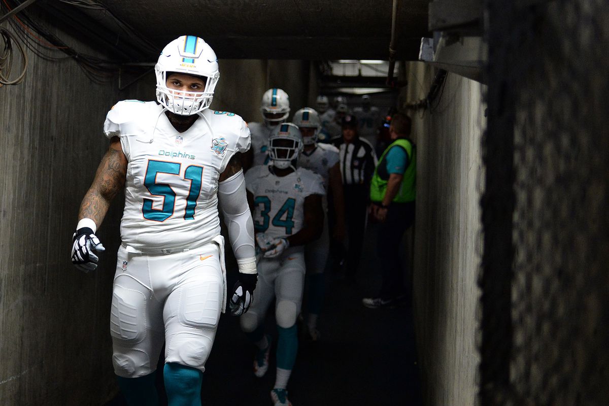 SAN DIEGO, CA - Miami Dolphins center Mike Pouncey (51) walks through the tunnel before a game against the San Diego Chargers at Qualcomm Stadium.