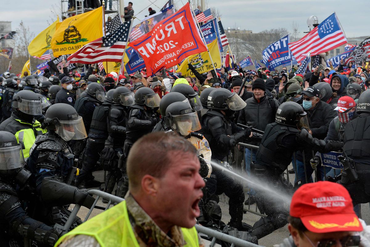 (FILES) In this file photo taken on January 6, 2021 Trump supporters clash with police and security forces as people try to storm the US Capitol in Washington DC. - Facebook on February 11, 2021 said it had tackled abuse on its network surrounding the deadly attack on the US Capitol by supporters of former president Donald Trump. The social network, which has been criticized for allowing some users to orchestrate violence that played out on January 6, also said it fed information to law enforcement agencies during the insurrection. (Photo by Joseph Prezioso / AFP) (Photo by JOSEPH PREZIOSO/AFP via Getty Images) ORG XMIT: 0