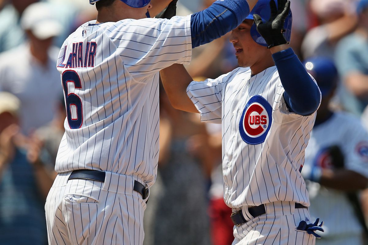 Is Bryan LaHair casting a spell?  Darwin Barney of the Chicago Cubs is greeted by LaHair after hitting a two-run home run against the Arizona Diamondbacks at Wrigley Field in Chicago, Illinois.  (Photo by Jonathan Daniel/Getty Images)