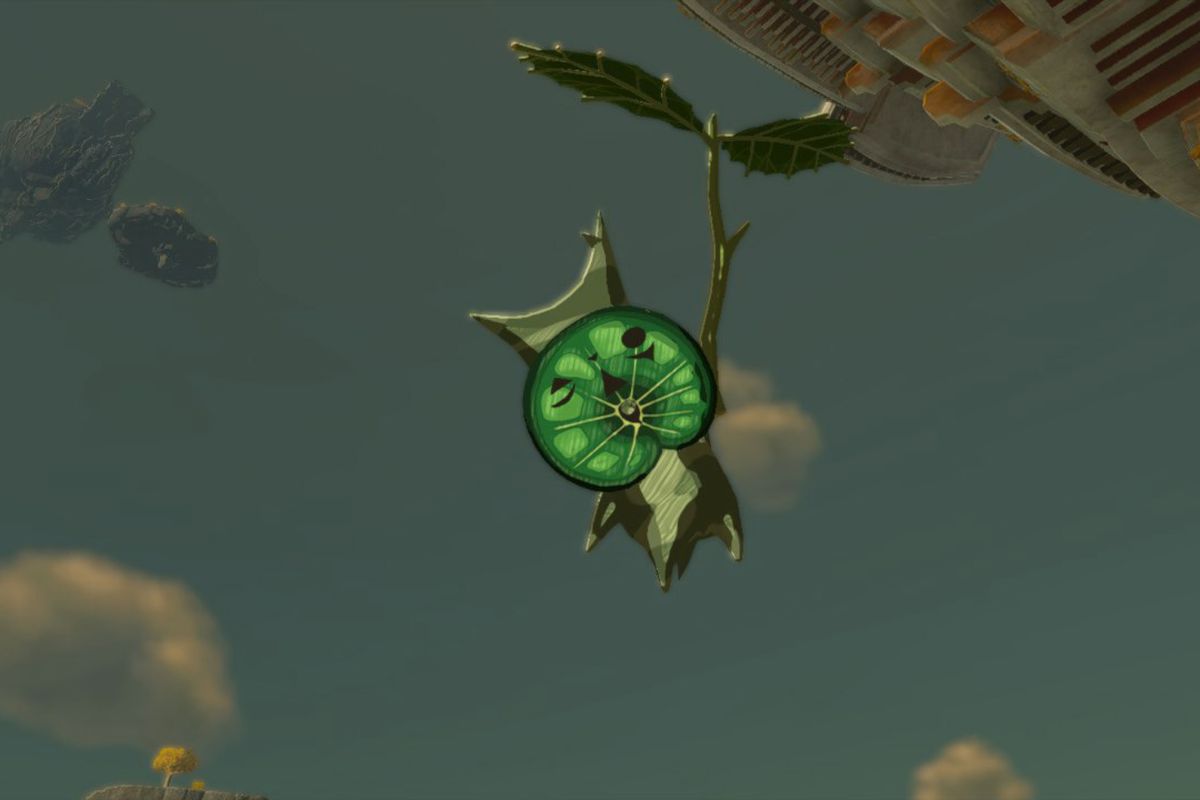 A Korok floats in mid air using a leaves branch in Zelda: Tears of the Kingdom