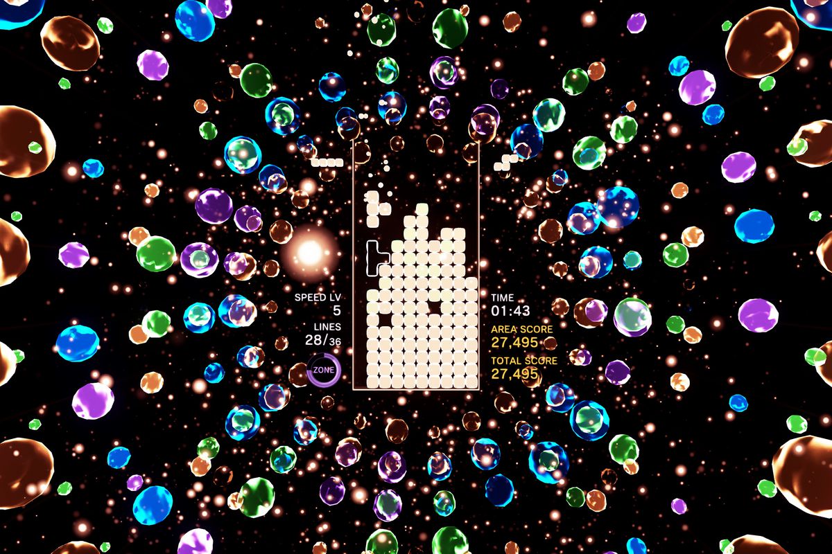 A T-shaped piece falls onto a bright puzzle field in a screenshot from Tetris Effect