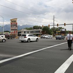 Elder Caden Dewey and Elder Bermudez Ibarra cross the intersection of 900 East and Fort Union Boulevard in Midvale, one of the 10 most dangerous intersections for auto-pedestrian accidents in Salt Lake County and Utah County, based on data from 2010-2016, on Tuesday, Aug. 8, 2017. It has been the site of 10 pedestrian crashes, four of them serious.