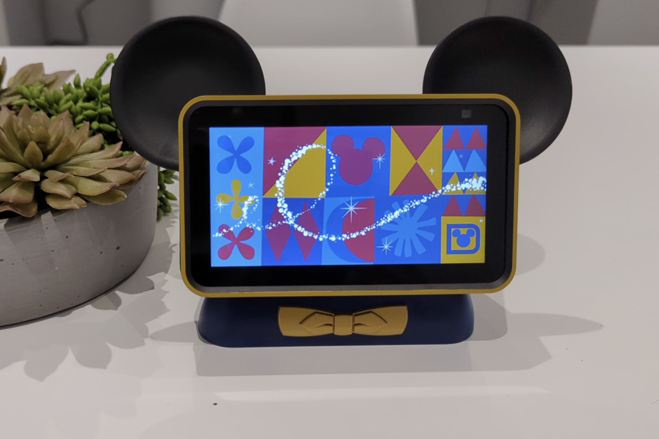 Photo shows a smart display with Mickey Mouse ears sitting on a table, waiting to respond to the “Hey Disney!” command.