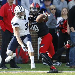 Cincinnati safety Davin Pierce (19) is called for pass interference as he defends against Brigham Young wide receiver Colby Pearson (3) during the first half of an NCAA college football game, Saturday, Nov. 5, 2016, in Cincinnati. (AP Photo/Gary Landers)