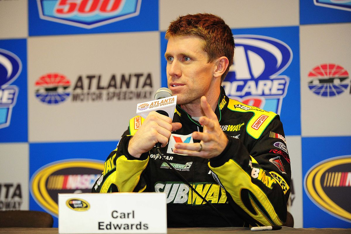 August 31, 2012; Hampton, GA, USA; NASCAR Sprint Cup Series driver Carl Edwards talks to the media following practice for the AdvoCare 500 at Atlanta Motor Speedway. Mandatory Credit: Kevin Liles-US PRESSWIRE