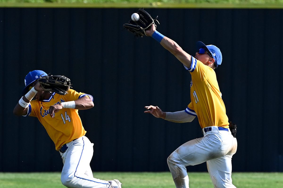 Goodpasture center fielder Jaron Elkins, right, calls off left fielder Bishop Quarles (14) as he catches a fly ball for an out against Tipton Rosemark in the second inning during the division II-A quarterfinal baseball game Wednesday, May 17, 2023, in Madison, Tenn.