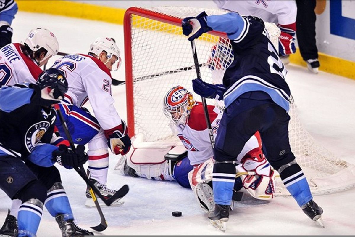 Feb. 26, 2012: Sunrise, FL, USA; Montreal Canadiens goalie Peter Budaj (30) blocks a shot from Florida Panthers right wing Mikael Samuelsson (26) during the second period at the BankAtlantic Center. Mandatory Credit: Steve Mitchell-US PRESSWIRE