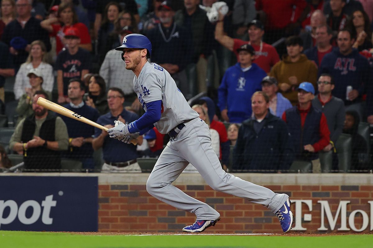 Cody Bellinger #35 of the Los Angeles Dodgers hits an RBI single during the fourth inning of Game Six of the National League Championship Series against the Atlanta Braves at Truist Park on October 23, 2021 in Atlanta, Georgia.