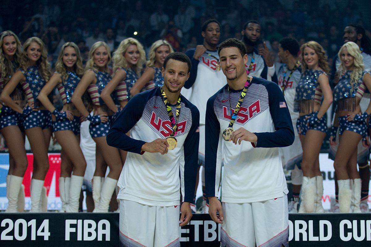 Stephen Curry and Klay Thompson display their gold medals after winning the 2014 FIBA World Cup