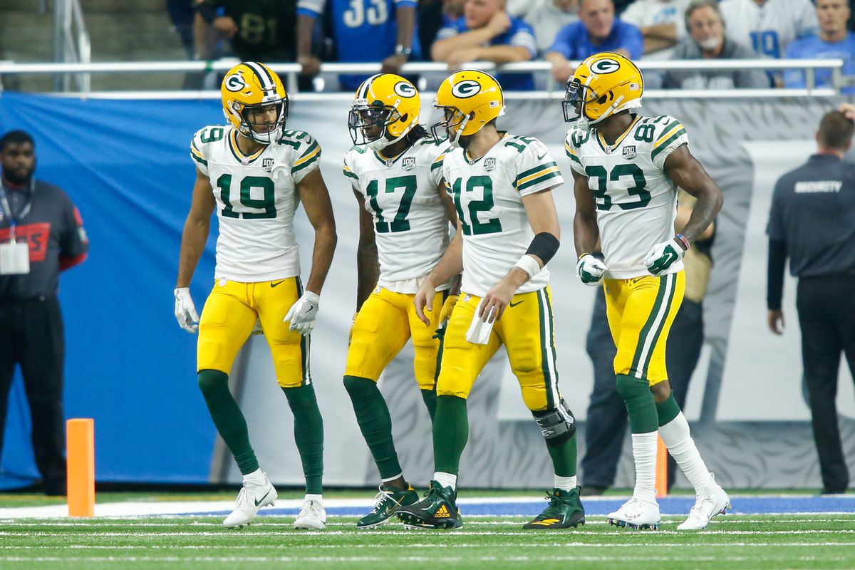 Green Bay Packers quarterback Aaron Rodgers walks to the sideline after a touchdown with Green Bay Packers wide receiver Equanimeous St. Brown, Green Bay Packers wide receiver Davante Adams, and Green Bay Packers wide receiver Marquez Valdes-Scantling during a regular season game between the Green Bay Packers and the Detroit Lions on October 7, 2018 at Ford Field in Detroit, Michigan.