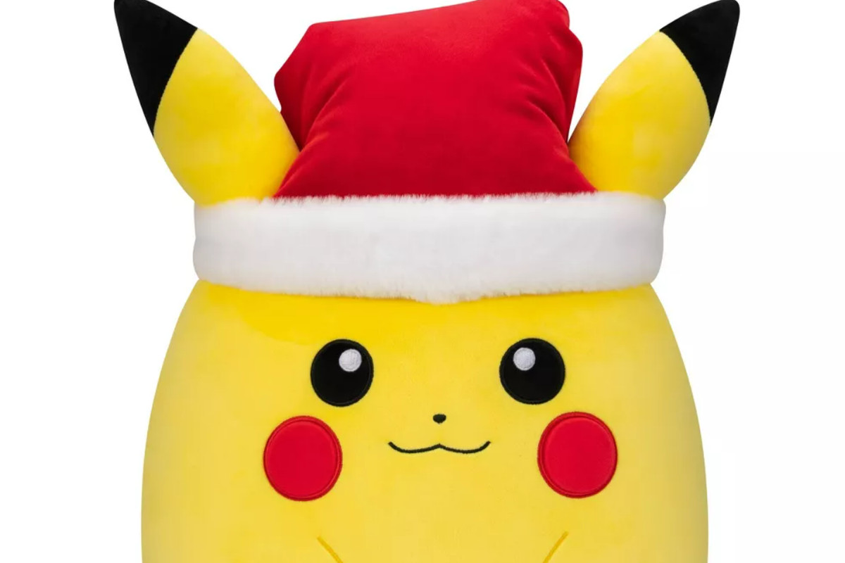 Round Pikachu Squishmallow plush wearing a red fluffy Santa hat