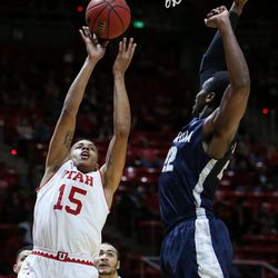 Utah Utes guard Lorenzo Bonam (15) shoots over Concordia’s Christopher Edward during a game at the Hunstman Center in Salt Lake City on Tuesday, Nov. 15, 2016.