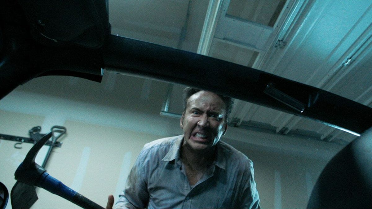 Nic Cage brandishing a pick-axe in Mom &amp; Dad (2017)