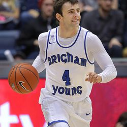 Brigham Young Cougars guard Nick Emery (4) brings the ball up court as BYU and Utah State play at the Marriott Center in Provo Wednesday, Dec. 9, 2015.