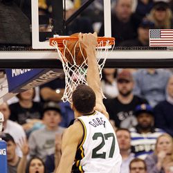 Utah Jazz center Rudy Gobert makes a slam dunk in the second half of an NBA regular season game against the Golden State Warriors at the Vivint Arena in Salt Lake City, Wednesday, March 30, 2016.