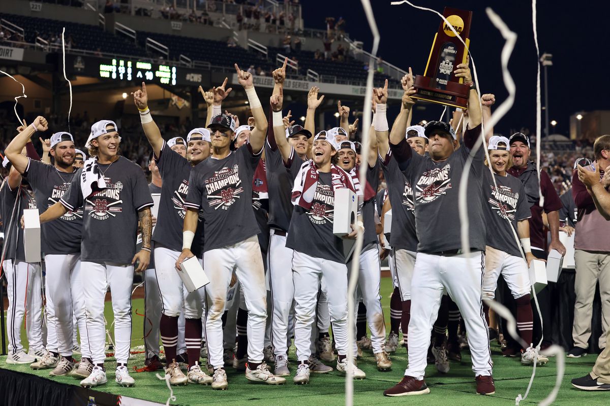 Head coach Chris Lemonis of Mississippi St. celebrates with the Championship trophy after Mississippi St. beat Vanderbilt 9-0 during game three of the College World Series Championship at TD Ameritrade Park Omaha on June 30, 2021 in Omaha, Nebraska.