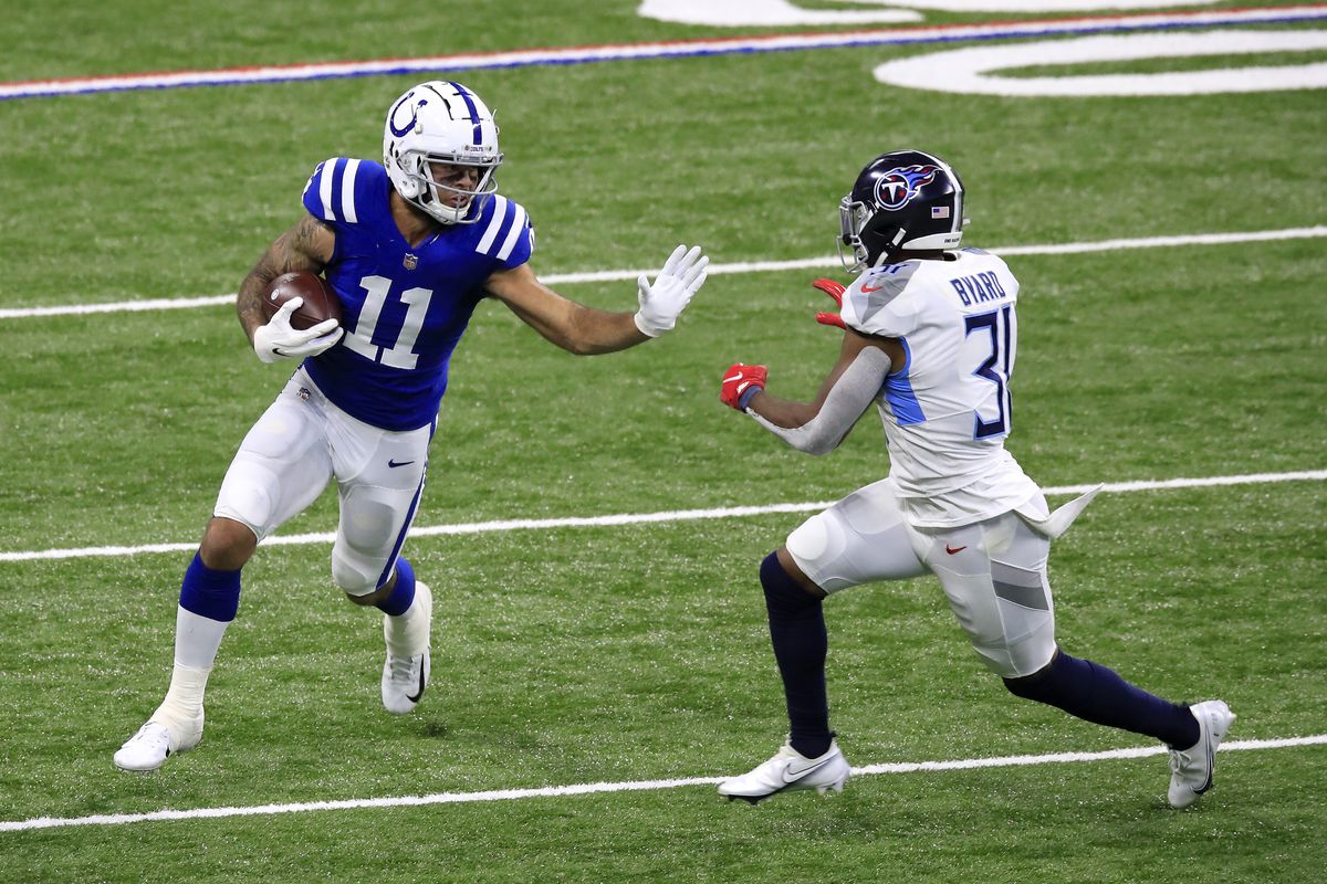 Michael Pittman Jr. #11 of the Indianapolis Colts attempts to break a tackle from Kevin Byard #31 of the Tennessee Titans in the fourth quarter during their game at Lucas Oil Stadium on November 29, 2020 in Indianapolis, Indiana.