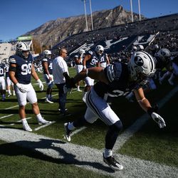 Brigham Young University players warm up before a game against the UMass Minutemen at LaVell Edwards Stadium in Provo on Saturday, Nov. 19, 2016.