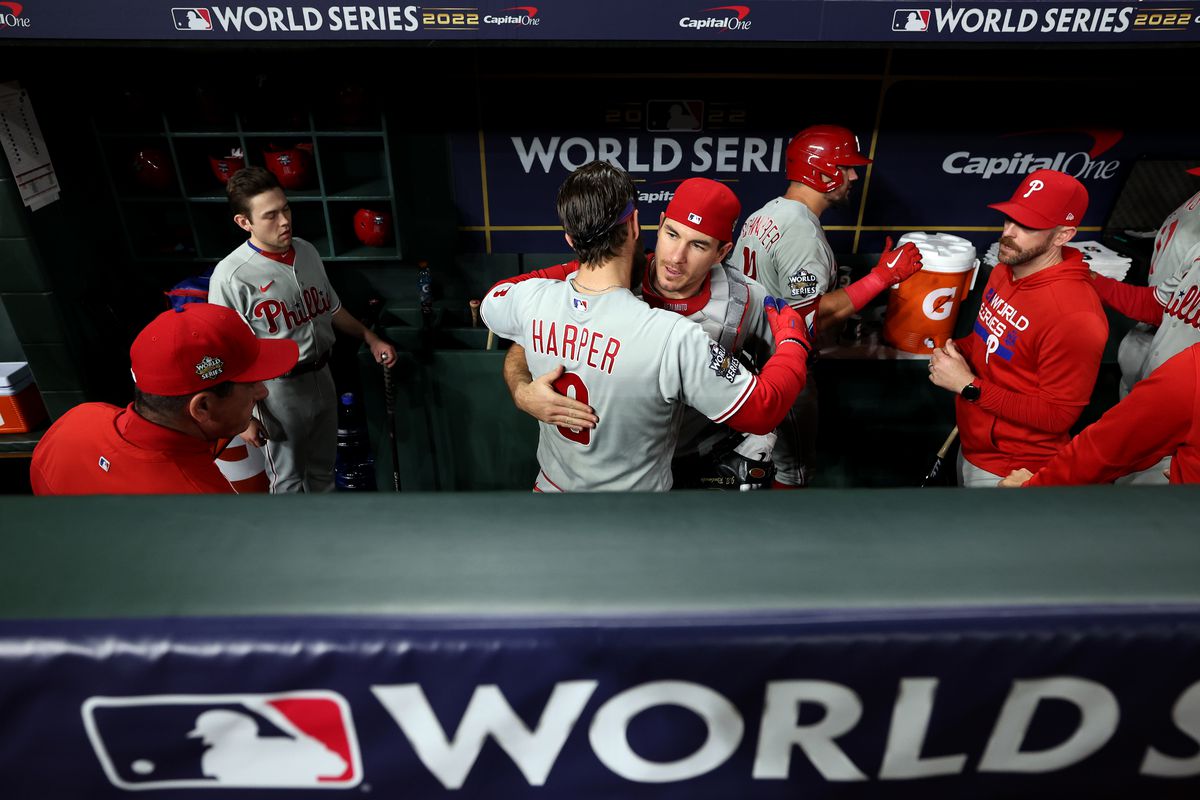 Bryce Harper and J.T. Realmuto of the Philadelphia Phillies get ready in the dugout prior to Game 6 of the 2022 World Series between the Philadelphia Phillies and the Houston Astros at Minute Maid Park on Saturday, November 5, 2022 in Houston, Texas.