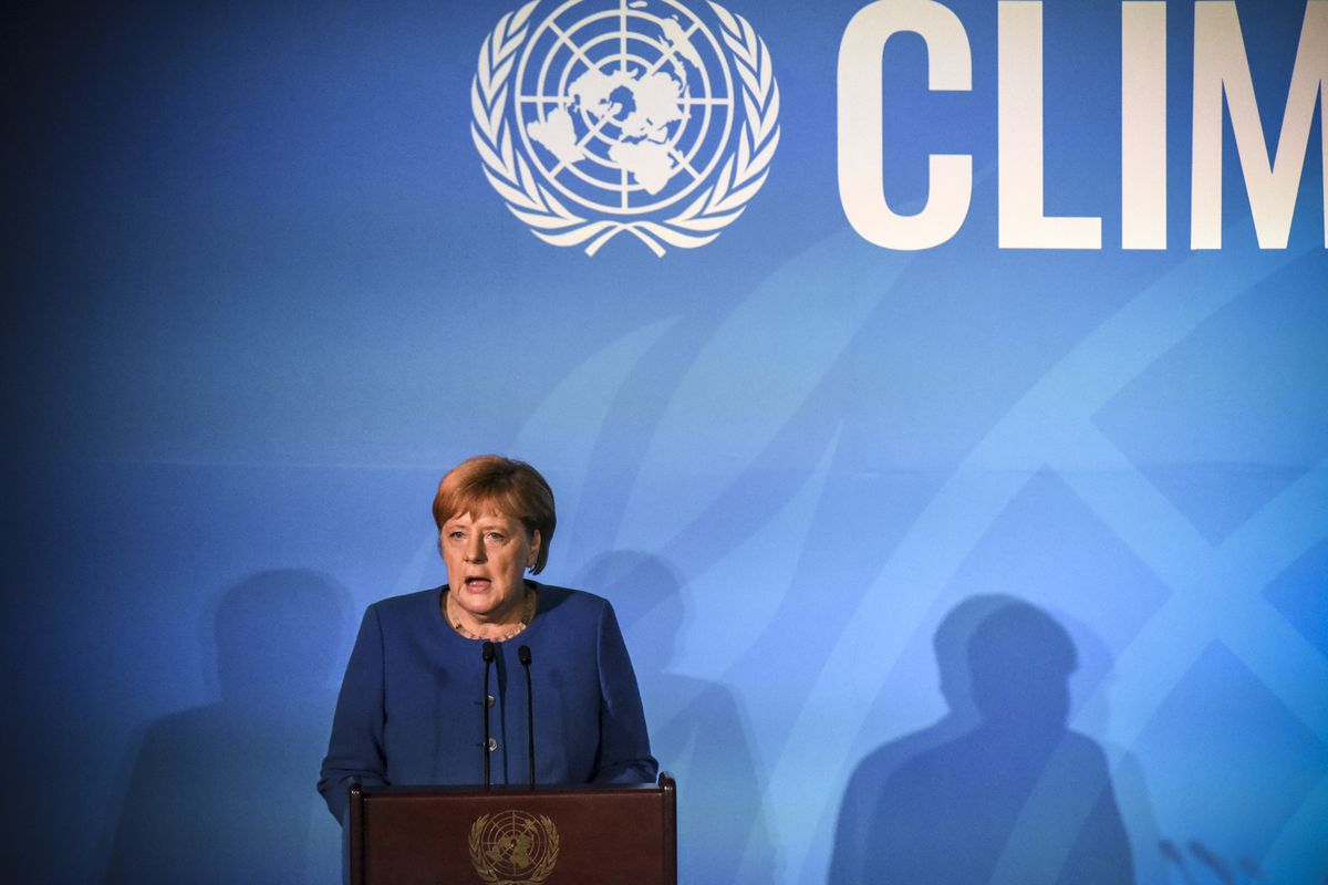 German Chancellor Angela Merkel onstage speaking from the podium at the UN Climate Summit.
