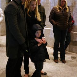 Jess and Meredith Krannich, with their son, Dylan, attend a vigil honoring those affected by the school shooting at Sandy Hook Elementary School in Newtown, Conn., outside of the state Capitol in Salt Lake City on Friday, Dec. 14, 2012.