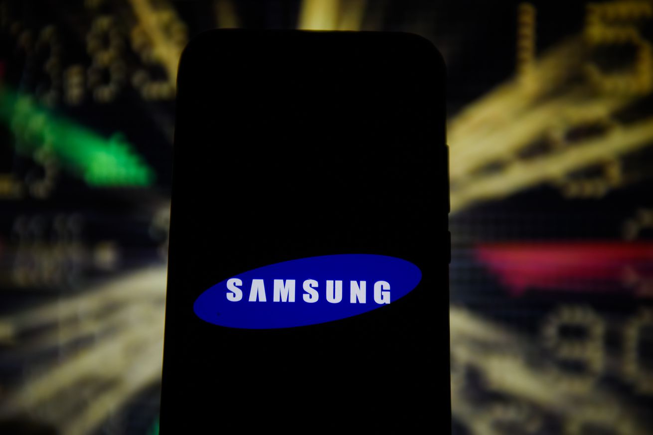 In this photo illustration a Samsung logo is seen displayed...