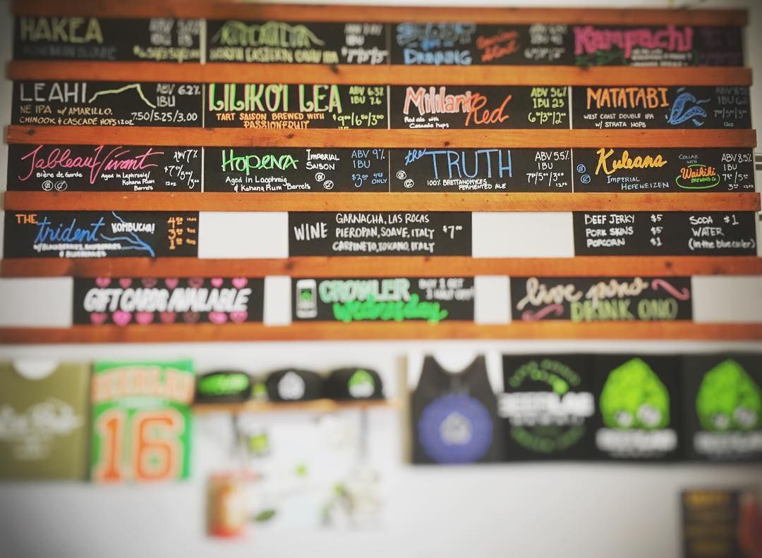 A wall with a customizable menu of handwritten signs