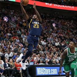Utah Jazz forward Royce O'Neale (23) goes for a big layup ahead of Boston Celtics guard Terry Rozier (12) at Vivint Smart Home Arena in Salt Lake City on Wednesday, March 28, 2018.