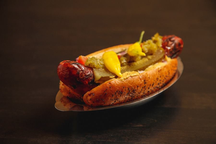 A large duck fat hot dog with Chicago-style toppings.