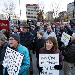 Protesters rally in Salt Lake City on Thursday, Nov. 8, 2018, following the resignation of Attorney General Jeff Sessions. At front are Stephen Trimble and Nancy Olson.