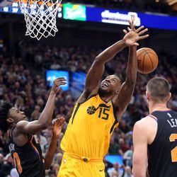 Phoenix Suns forward Josh Jackson (20) fouls Utah Jazz forward Derrick Favors (15) during a basketball game at the Vivint Smart Home Arena in Salt Lake City on Wednesday, Feb. 14, 2018. Jazz won 107-97.
