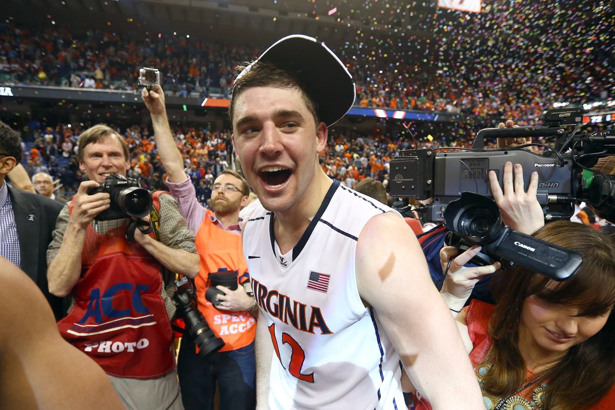 GREENSBORO, NC - MARCH 16: Joe Harris #12 of the Virginia Cavaliers celebrates after beating the Duke Blue Devils in the finals of the 2014 Men's ACC Basketball Tournament at Greensboro Coliseum on March 16, 2014 in Greensboro, North Carolina.