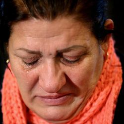 An Iraqi Assyrian woman who fled from Mosul to Lebanon weeps during a sit-in for abducted Christians in Syria and Iraq, at a church in Sabtiyesh area east Beirut, Lebanon, Thursday, Feb. 26, 2015. Islamic State militants snatched more hostages from homes in northeastern Syria over the past three days, bringing the total number of Christians abducted to over 220 in the one the largest hostage-takings by the extremist group, activists said Thursday. 