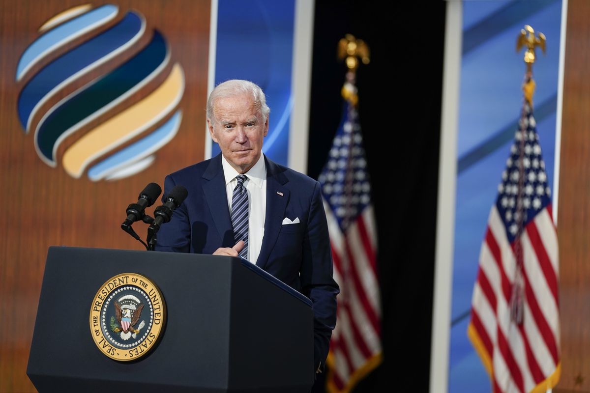 President Joe Biden answers questions after delivering closing remarks to the virtual Summit for Democracy.