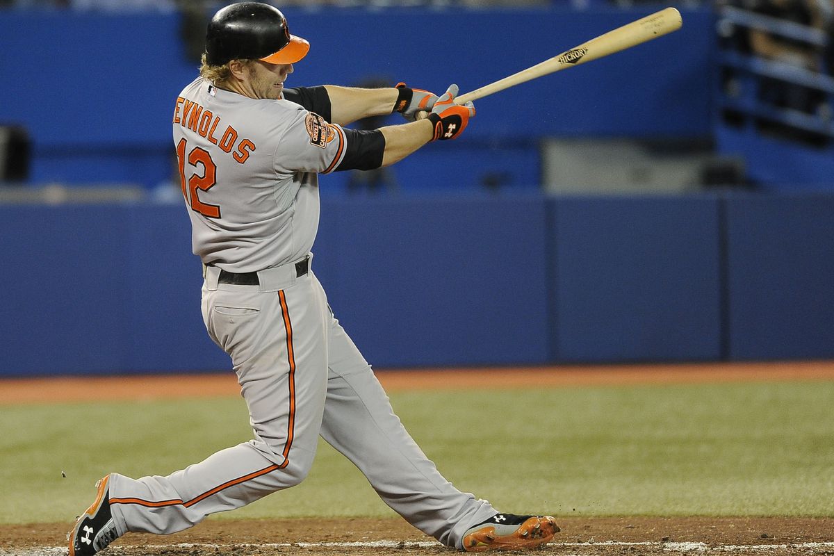 TORONTO, CANADA - SEPTEMBER 4:  Mark Reynolds #12 of the Baltimore Orioles hits a fifth inning home run during MLB game action against the Toronto Blue Jays.