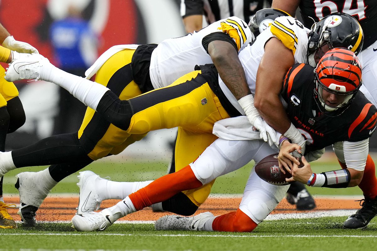 Cincinnati Bengals quarterback Joe Burrow (9) is sacked by Pittsburgh Steelers linebacker Alex Highsmith (56) during the first quarter of a Week 1 NFL football game at Paycor Stadium. Mandatory Credit: Sam Greene