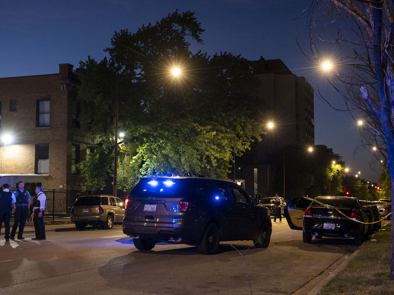 Chicago police work the scene where a vehicle struck and critically wounded a Chicago Police Officer at in the 6300 block of South Michigan, afterwards it was abandoned in the 6100 block of South Indiana, in the Washington Park neighborhood, Friday, Aug. 13, 2021.
