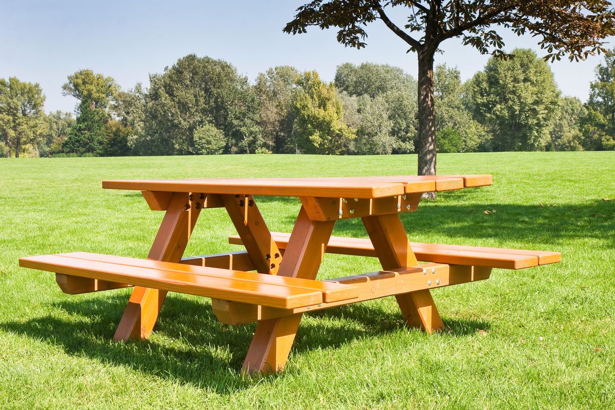 Picnic table in large yard.
