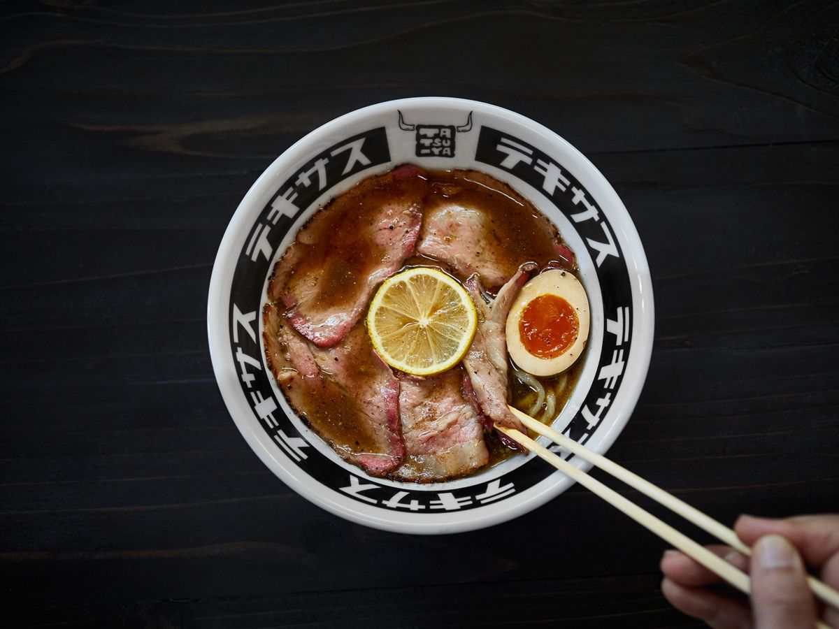 A bowl of ramen with meats.