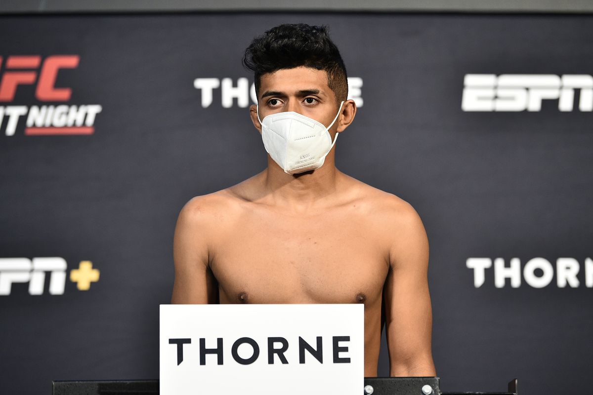 Jonathan Martinez poses on the scale during the UFC Fight Night weigh-in at UFC APEX on July 31, 2020 in Las Vegas, Nevada.