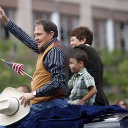 Gov. Gary Herbert waves to the crowd while riding in the the Days of ’47 Parade in Salt Lake City on Monday, July 25, 2011.